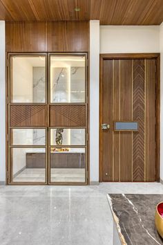 an empty room with wooden doors and marble counter tops