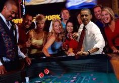 a group of people standing around a casino table