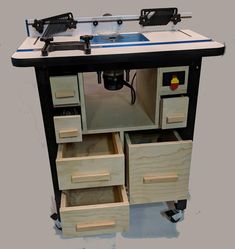 a workbench with drawers and tools on it