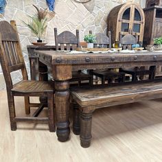 a wooden table with two chairs and a bench