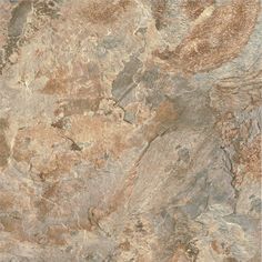 an image of a marble floor with brown and tan colors on it's surface