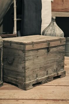 an old trunk is sitting on the floor