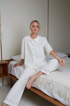 "Most adorable linen pajama set for women in white eco linen. The linen loungewear luxury with delicate cotton lace Nice trapeze style short jacket with Peter pan collar and long pants with delicate cotton lace decoration at jacket and pants bottoms. This stunning pajama you can buy as a wedding, birthday or anniversary gift. ITEM DETAILS: Jacket: - Short trapeze shape jacket - Buttoned down front - Peter Pan style collar - 3/4 length sleeves - Jacket back length - 23\" (58.5cm) - At jacket bott Cotton Pyjama Set Women, White Pajamas Aesthetic, Linen Pjs, French Pajamas, Lace Pyjamas, Luxurious Loungewear, Pajamas For Women, White Feminine Sleepwear With Relaxed Fit, White Feminine Sleepwear For Relaxation