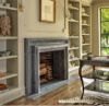 a living room filled with furniture and a fire place