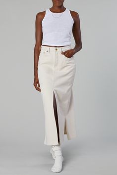 The Panama Skirt in Bone is inspired by denim in the 90's. The Panama is an A-Line Maxi Skirt with an exaggerated front slit and 2 side slits. It features a traditional button fly and our signature 'SH' embroidery. We partnered with a sustainable fabric mill for this consciously made cotton jean. This fabric is made of 80% up-cycled cotton fibers. It's synthetic free, un-dyed and produced in a completely closed-loop manufacturing facility.These jeans are compostable so one day they'll become one with the earth again leaving behind only our gold shank buttons. White Denim Midi Skirt, Split Midi Skirt, White Skirt Outfits, Mid Length Skirts, Denim Midi Skirt, Australian Fashion, Citizens Of Humanity, China Fashion, Sustainable Fabrics