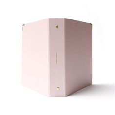 a pink box sitting on top of a white surface