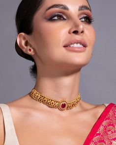 * 24K Gold Plated Handcrafted Intricate Choker Jewellery Set * Gold plated necklace, has a drawstring closure * Gold plated earrings, has a post and back closure * Size:- Necklace length: 25.3 cm Earrings length: 1.6 cm(each) *Material:- Material: Brass Plating: Gold-Plated Stone Type: CZ, Ruby stones and beads NOTE All the raw material used in this product is of high quality and is handcrafted with love. Premium Quality and High craftsmanship 100% Satisfaction Guarantee: Long Lasting Plating, H Gold Cutdana Choker Necklace, Festival Temple Choker Necklace For Celebration, Festival Choker With Latkans For Gift, Festival Gift Choker With Latkans, Festival Latkans Choker As Gift, Festive Gift Choker With Latkans, Gold Choker With Latkans For Celebration, Festive Celebration Choker With Latkans, Ruby Choker Necklace