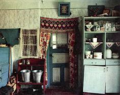 an old fashioned kitchen with pots and pans