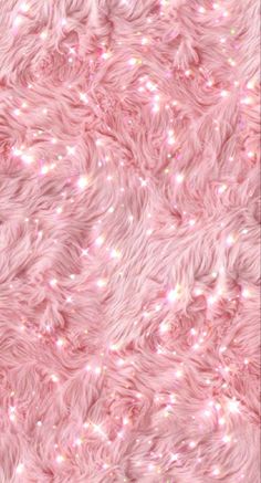 a pink fur texture with lots of small white lights on the top and bottom of it