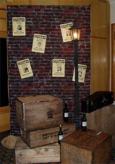 several wooden boxes stacked on top of each other in front of a brick wall