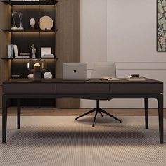 a desk with a laptop on it in front of a bookshelf and shelves