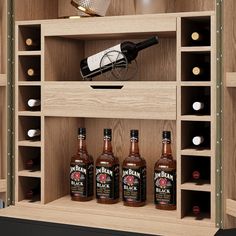 three bottles of liquor are in a wooden shelf