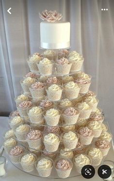 a wedding cake made out of cupcakes