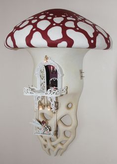 a white and red mushroom shaped light fixture