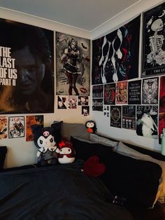 a bedroom with many posters on the wall