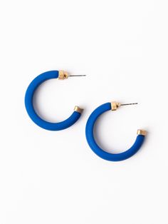 Introducing our Amanda Hoop Earrings: a vibrant and playful addition to your jewelry collection. Crafted from high-quality resin, these bold hoop earrings are sure to make a statement. Lightweight and comfortable for all-day wear, the Amanda Hoop Earrings are perfect for adding a pop of color to any gameday outfit. Available in three sizes: Small - 1 inch, Medium - 1.5 inches, Large - 2 inches Details: Resin hoop earrings Hypoallergenic Surgical steel posts Nickel and lead free Care Instructions Resin Hoop Earrings, Earrings Hypoallergenic, Luxe Jewelry, Gameday Outfit, Earrings Blue, Summer Ready, Cleaning Products, Shoe Sale, Jewelry Sales