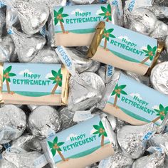 happy retirement candy bar wrappers are on top of silver foiled hersheys