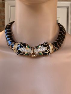 "Stunning Signed CINER necklace in the ultra rare ,highly collectible double panther style circa 1980s. Excellent vintage condition. This necklace lays beautifully on the neck and the rare twin panther heads are encrusted with sparking clear Swarovski crystals and striking green glass cabochon eyes. The body of the necklace is composed of flexible links of shiny bright black enamel set in 18k gold-plate.   The necklace measures approx: 16-1/2 long by 7/8\" wide, and the center panthers are approximately: 3-1/4\" by 1\" (at the widest/longest point). The necklace weight substantial- approx: 143 grams.   The CINER mark is at the back near the clasp. The condition of this fabulous piece is in excellent / near mint vintage condition with very little signs of wear. Looks hardly worn.! Superb qu Panther Necklace, Elizabeth Taylor, Black Enamel, Cute Jewelry, Green Glass, Cartier, Panther, Costume Jewelry, Jewelry Sets