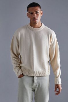 Men’s knitwear has come a long way, which means you can now keep your look cool while you stay warm in our selection of jumpers and cardigans for men. A staple to add into your off-duty rotation, the crew neck jumper is an ideal transition layer that works day to night and smart to casual. If you are looking to up your sweater game without needing to put in any extra effort, our selection of cable knit jumpers is all you need to wear when the cold season kicks in. Looking for a more sophisticated combo? Layer a roll neck jumper under a blazer and finish off with skinny jeans and smart shoes. Sweater Outfits Men, Jumper Designs, Jumper Outfit, Sweater Season, Men's Pullover, Shawl Cardigan, Tapered Trousers, Oversized Coat, Men Street