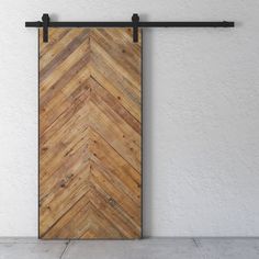 an open wooden door hanging on a wall