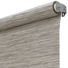 a close up view of a roller shade with the curtain pulled back to reveal an interesting pattern