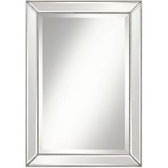 a silver framed mirror with beaded trimmings on the edges and bottom edge