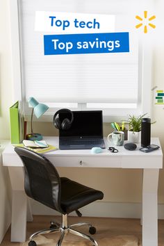 a desk with a laptop computer on it and a sign that says top tech savings