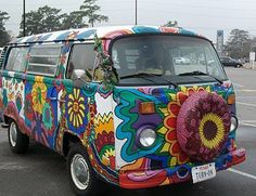 the van is decorated with flowers and has an interesting design