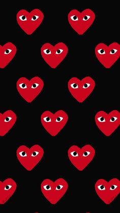 red hearts with eyes on black background