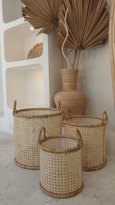 three wicker baskets sitting next to each other