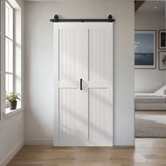 Hall Closet Barn Door, Small Laundry Room Doors, Bi Fold Barn Doors Bathroom, Barn Door Folding Doors, Bi Fold Doors Closet, Laundry Bifold Door Ideas, Sliding Barn Door Laundry Room, Foldable Barn Door, Laundry Room Barn Door Ideas