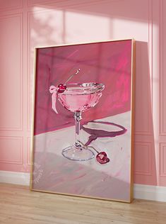 a painting of a martini glass on a pink wall