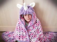 This handmade crochet hooded unicorn blanket is super soft and warm, and it can be folded to form a pillow. You can cover yourself while sitting on the couch or you can wrap yourself in it. It is made with a super soft bulky yarn and can be customized with different color combinations! Do you want a color that is not listed? Just contact me! The body of the blanket is made with a marbled effect color, and the hood will have a matching solid color. If you want something different, please add your request in the comments when you order. DIMENSIONS: the dimensions do not include the hood. The age group is a suggestion, please make sure the dimensions are the right ones for you.  The blanket in the picture is a teen size, the model is 10 years old.  PRESCHOOL: Width 32" - Length 35" (doesn't i Unicorn Blanket Crochet, Unicorn Hooded Blanket, Crochet Unicorn Blanket, Crochet Unicorn Hat, Unicorn Blanket, Cat Ears Hat, Pillow Blanket, Unicorn Pillow, Unicorn Bag