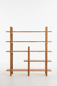 a wooden book shelf with three shelves on one side and two bookshelves on the other