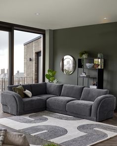 a living room filled with furniture next to a large window covered in plants and potted plants