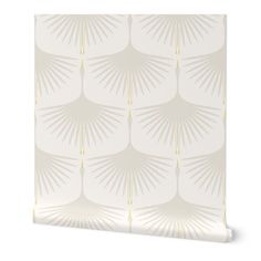 a wallpaper with palm leaves in white and gold on the front, against a white background