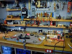 a workbench with many tools on it