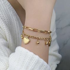 This exquisite 1998 Gold Bracelet is crafted with a plating of 18K Gold and a Figaro Chain design. Its adjustable length measures 18+4cm(8.66inches), and it is hypoallergenic. Buy with confidence, knowing you're receiving a fashion-forward design in high-quality Stainless steel 316L with exceptional customer service and the best price. Girls Bracelet, Mens Chain Bracelet, 18k Gold Bracelet, Bow Bracelet, Gold Armband, Love Charms, Layered Bracelets, Love Bracelets, Color Oro