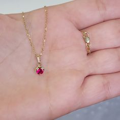 "Dainty small and really cute ladybug necklace, available in 14k yellow rose and white solid gold. showcases one natural ruby, 4 black + 2 white mined diamonds. Absolutely the perfect gift for any occasion !! Details : * Height: 10mm * Width: 5.9mm * Thickness: 3.5mm * Stone material: Ruby+ Black and White Diamonds * Stone shape: Round * Total number of CZ stones: 6 * Stone setting: Prong and pave setting * Metal: 14k Solid Yellow Gold * Finish: High Polish Diamond Details Total Diamond Weight: Ladybug Necklace, Cute Ladybug, Lady Beetle, Antique Jewellery Designs, Gold Jewelry Simple, Ruby Pendant, Stone Material, Stone Setting, White Solid