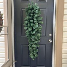 a door with a wreath hanging from it's side