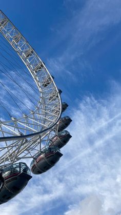 the ferris wheel is high up in the sky