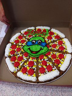 there is a decorated pizza in the box