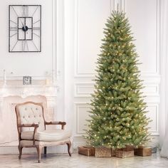 a living room with a christmas tree in the corner and a chair next to it