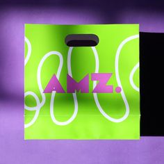 a purple and green shopping bag with the word sale printed on it's side