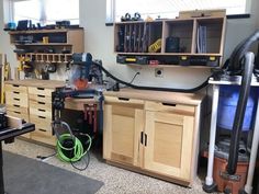 a workbench with various tools and equipment on it in a home office area