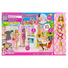 a barbie doll house with two dolls in the front and one on the back side