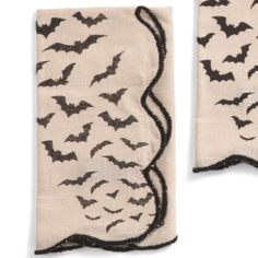 two pieces of cloth with bats on them