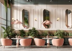 the interior of a restaurant with pink chairs and mirrors on the wall, along with potted plants