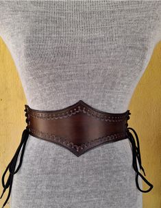 It is Handmade leather corset with Tooled beautiful designs. Handmade and hand dyed belt with high quality leather. It is adjustable with lace.  MEASUREMENTS: XS : 58cm - 64 cm / 23" in -25" in S : 66 cm - 74 cm / 26" in - 29"in M : 75 cm-85 cm / 29.5 "in - 33.5" in L: 85 cm-95  cm / 33.5 "in - 37.4" in XL: 95 cm-105 cm / 37.4 "in - 41.3" in DETAILS: ► 100% handmade ► 100% genuine leather ► Made on your measurements ► Unique design ► Battle ready ► LARP standard ► Worldwide delivery NOTE: This i Leather Underbust Corset, Leather Tutorial, Leather Corset Belt, Medieval Belt, Tooling Patterns, Corset Belt, Underbust Corset, Leather Corset, Suspender Belt