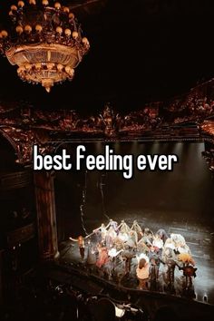 the words best feeling ever are in front of an image of a stage with people on it